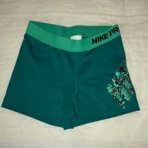 Teal nike pro 5” shorts.